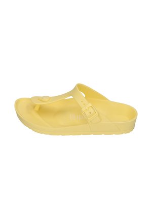 Yellow rubber thong sandal with adjustable buckle strap and textured sole shown from the side on white background.