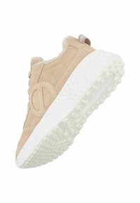 Beige suede sneaker with faux fur lining, white textured sole, and a prominent logo on the side. Rounded shape with cushioned support.