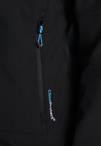 Black softshell jacket fabric with a zippered pocket featuring blue cord. Logo "ClimaProtect" in blue near the pocket seam.