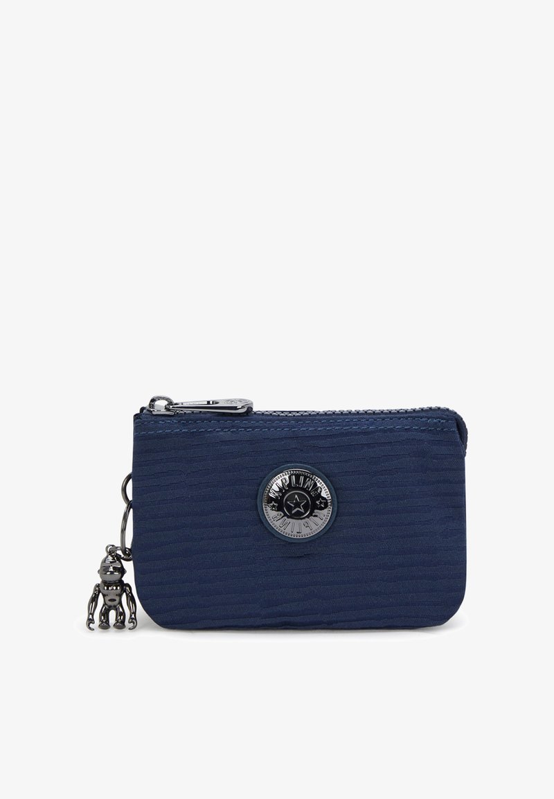 Navy blue zippered wallet made of textured fabric, featuring a round silver logo and a charm of a small robot attached to the zipper pull.