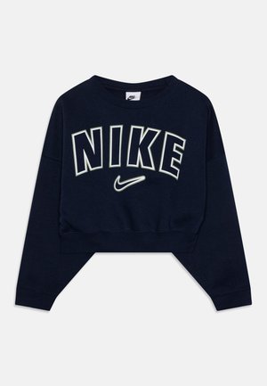 Marineblå cropped sweatshirt med lange ærmer, der har stor hvid omrids NIKE-tekst og Nike swoosh-logo under.