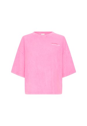 T-shirt rose oversize à manches courtes avec col rond, présentant un petit texte blanc en haut à gauche indiquant "Out of office SELF LOVE CLUB".