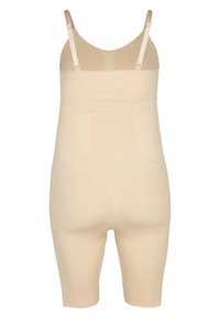 Beige shapewear bodysuit, featuring adjustable straps, seamless design, and a textured finish. Coverage extends to mid-thigh.