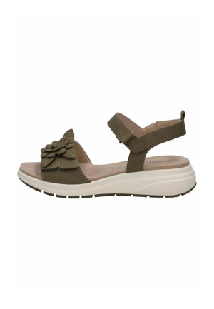 Sandales vertes avec un accent floral, une bride ajustable et une semelle intérieure rembourrée sur une semelle blanche profilée pour le confort et le soutien.