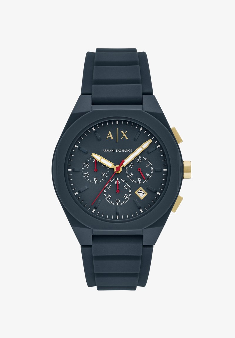 Tamno plavi silikonski sat s okruglom kućištem, zlatnim detaljima, tri podbroja i prikazom datuma. Ima velike, lako čitljive brojeve.