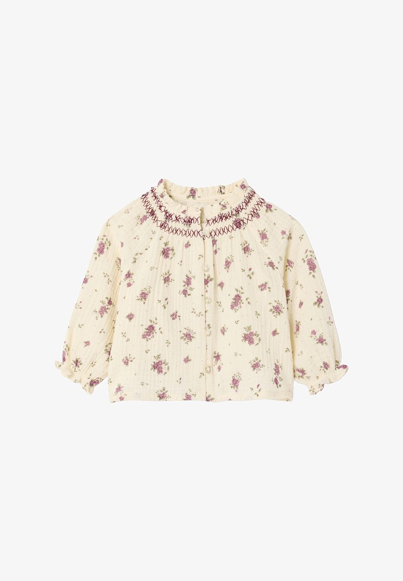 Blumenmuster-Bluse aus cremefarbenem Stoff mit rosa und grünen Blumenmustern, gerafftem Ausschnitt und puffärmeligen, elastischen Bündchen.