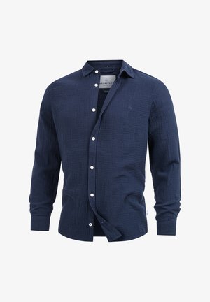 Navy-blaues Langarmhemd aus strukturiertem Stoff, mit Knopfleiste und Kragen. Mit Markenlabel und weißen Knöpfen.