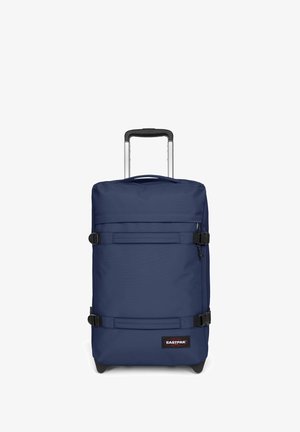 Maleta rodante de color azul marino, fabricada con un material duradero, que cuenta con un mango telescópico, dos correas de tejido y un logotipo negro en la parte frontal.