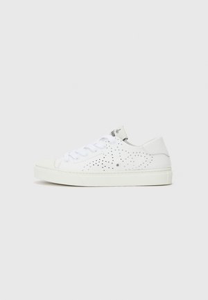 White low-top sneakers with perforated design, flat laces, and a textured rubber sole. Features a minimalistic style and soft finish.