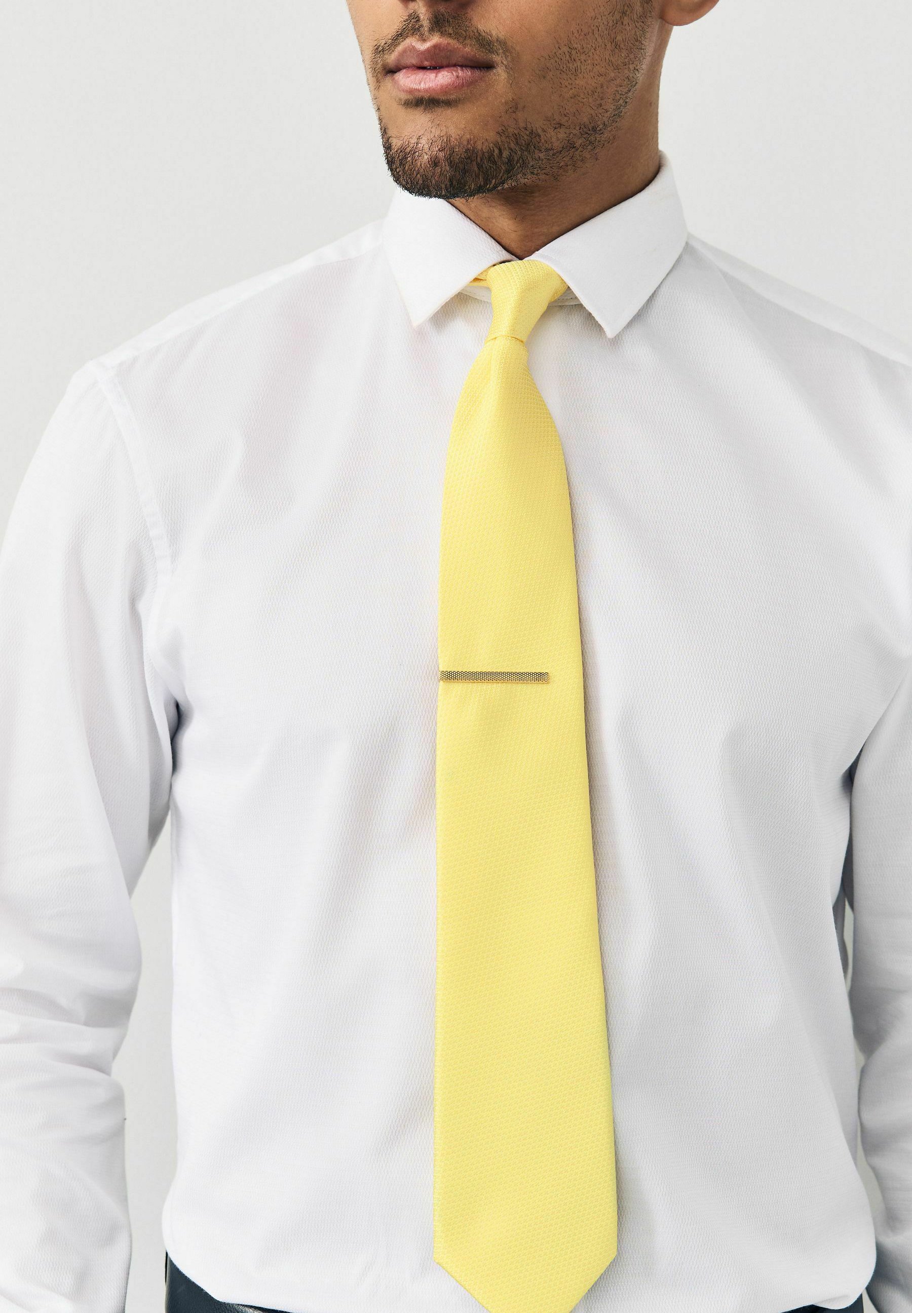 yellow tie with white shirt