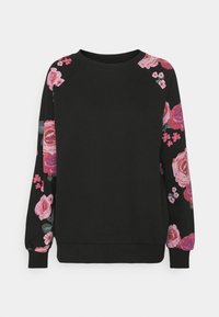 Černá mikina s růžovým květinovým vzorem na rukávech, žebrovaným výstřihem a manžetami a volným střihem. Standardní styl s kulatým výstřihem.