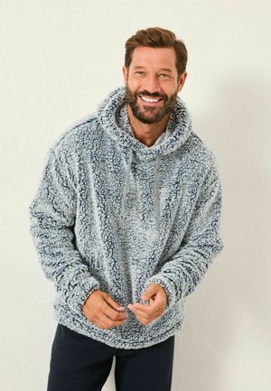 Fuzzy, light gray pullover hoodie with a large hood, front pocket, and drawstrings. Ribbed cuffs and hem with a soft, textured finish.