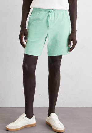 REGULAR - Tracksuit bottoms - dusty aqua