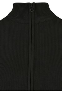 Tessuto a maglia costina nero con collo alto e cerniera nera centrale che si estende dalla scollatura verso il basso.