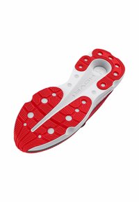Semelle de chaussure avec un schéma de couleurs rouge et blanc ; caoutchouc texturé pour une meilleure adhérence ; présente des rainures distinctes et des découpes circulaires pour plus de flexibilité.