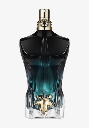 Parfümflasche in Form eines männlichen Torsos, mit dunkel verlaufendem Glas und Goldelementen nahe der Basis sowie einem goldenen Sprühkopf oben.