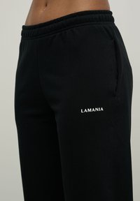 LA MANIA Teplákové kalhoty - black