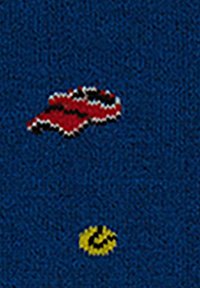Red and black lips graphic on a blue textured background, featuring a small yellow smiley face detail, creating a playful design.