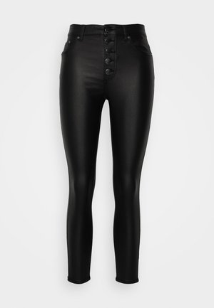 Mustad kõrge vöökohaga skinny teksad mustas värvitoonis, sileda ja läikiva tekstuuriga, viie nupuga esikinnitus ja klassikalised denim-stiilis taskud.