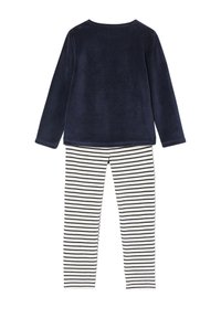 Navy fleece long-sleeve top with round neckline paired with striped navy and white leggings. Soft texture, casual design.