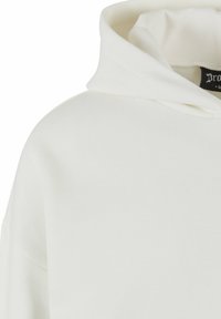 White hoodie featuring a drawstring hood, soft cotton material, relaxed fit, and minimalistic design without patterns or embellishments.