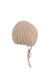 Beige knitted baby bonnet with ribbed pattern and tied string under the chin, isolated on white background.