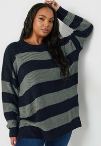 Marinblå och grå randig oversized stickad tröja med ett ribbat mönster, rundad halsringning och långa ärmar, med en avslappnad passform.