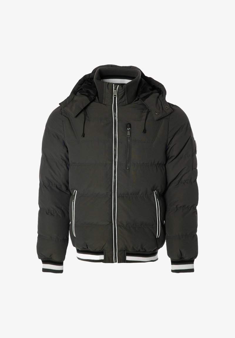 Tummanvihreä puhvijakku, jossa on irrotettava huppu, valkoiset yksityiskohdat, vetoketjulliset taskut ja ribbaatut hihansuut. Jakussa on vetoketjusuljenta ja tikattu pinta.