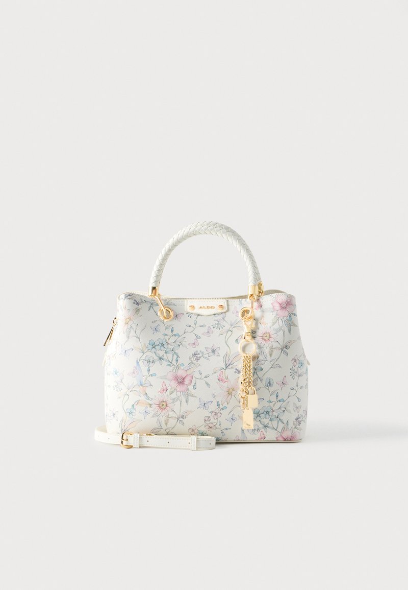 Bolso blanco con patrón floral en rosa y azul. Cuenta con asa trenzada y herrajes dorados con charm. Incluye correa de hombro desmontable.