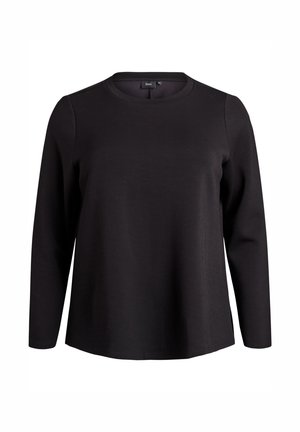 Camisa negra de manga larga con cuello redondo, corte relajado y diseño liso, exhibida sobre un fondo blanco.