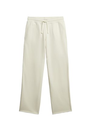 Kremowe spodnie dresowe wykonane z miękkiego materiału. Charakteryzują się luźnym, prostym krojem oraz elastycznym paskiem w talii z sznurkiem.