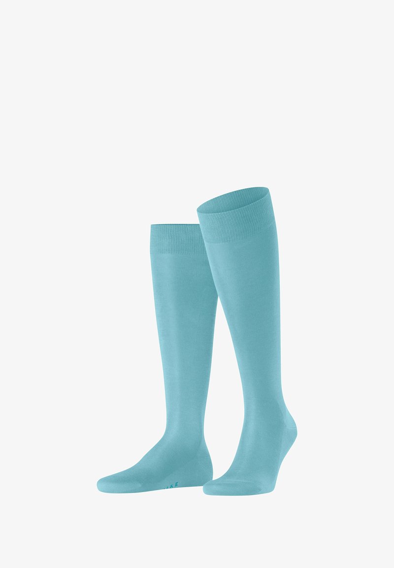 Kniestrümpfe in einem einfarbigen hellblauen Farbton. Hergestellt aus einem glatten Stoff mit einem gerippten Bündchendesign. Standardform und elastisch für perfekten Sitz.