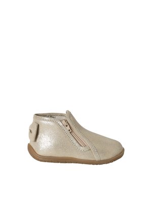 Beige toddler ankle boot with side zipper, rounded toe, and brown rubber sole, shown in profile on white background.