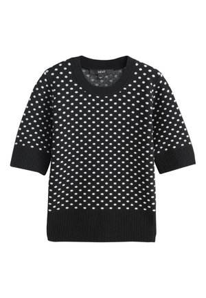 Pull noir en maille à manches courtes avec pois blancs, poignets, ourlet et encolure ronde côtelés.