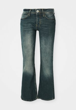 Jean en denim évasés de couleur bleu foncé avec une finition délavée, dotés d'une fermeture à bouton et à zip, de cinq poches et d'accents de couture.