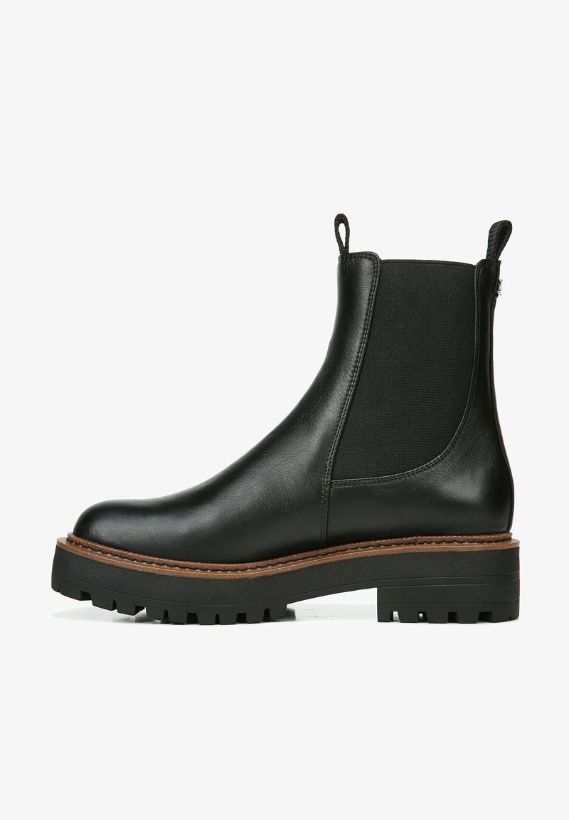 Stivale alla caviglia in pelle nera con pannelli laterali elastici, finitura testurizzata, suola in gomma spessa e linguette per facilitare l'indosso.