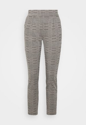 Ruterede bukser i sort, hvid og grå med en slim fit. Har høj talje og struktureret stof med linjer og ternede mønstre.