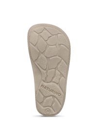 Beige shoe insole with a textured, patterned surface. Features a rugged tread design and embossed "NATURINO" branding with size "20."