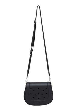 Petit sac bandoulière noir avec sangle réglable et trous circulaires perforés sur le rabat avant, fabriqué en matériau lisse.