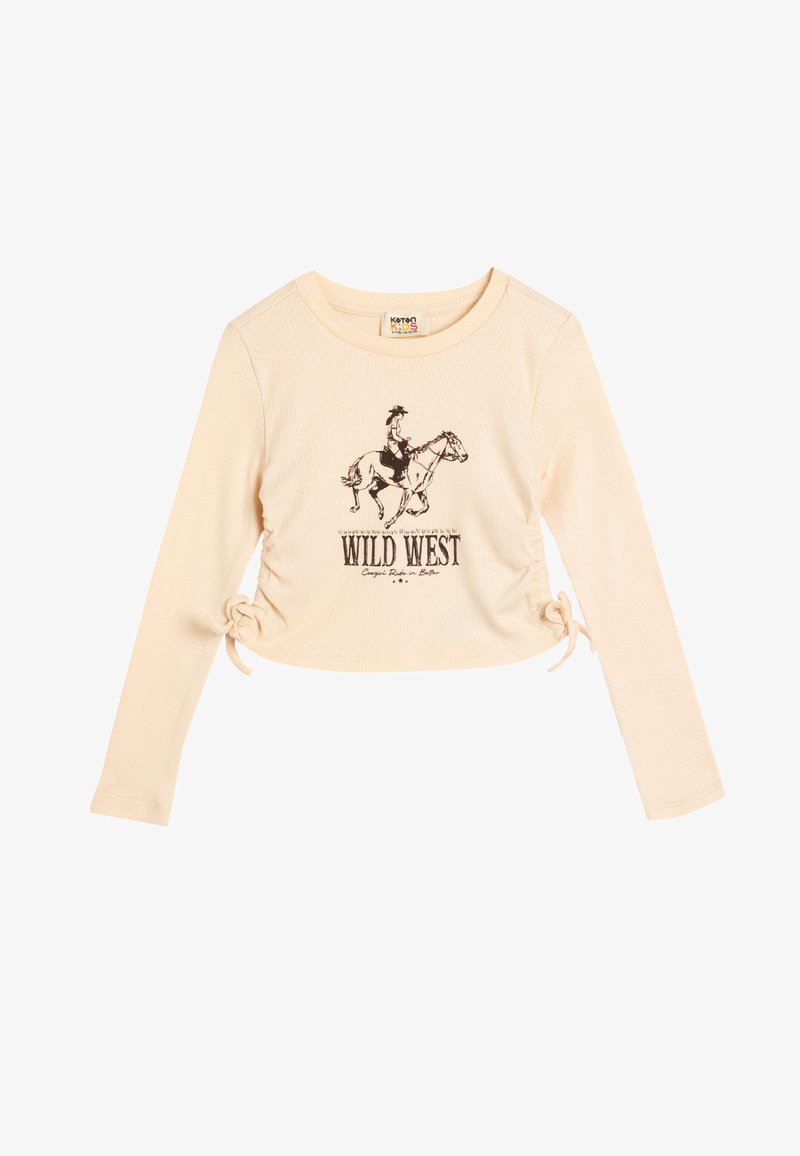 Jasno beżowa, krótka koszula z długim rękawem o prążkowanej strukturze, z czarną grafiką kowboja na koniu i napisem "WILD WEST" pod spodem.