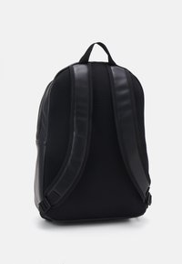 Black backpack featuring a smooth leather body and breathable mesh back. Padded adjustable straps with click fasteners. Rounded shape.