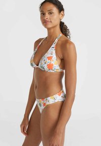 Floral bikini set featuring a triangular top with halter straps, and low-rise matching bottoms. Colors include white, orange, and green.