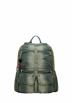 Green fabric backpack with multiple zippered compartments, flap pockets, mesh side panels, and a small "Desigual" logo on the front.
