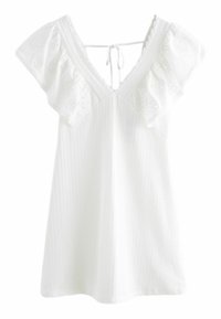 Robe courte blanche avec larges manches à volants en dentelle œillets, décolleté profond en V avec fermeture à nouer dans le dos.