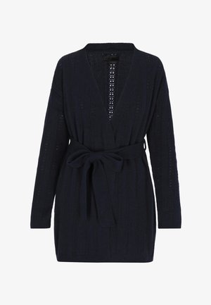 Navy knitted cardigan with long sleeves, open front, ribbed texture, and matching belt tied at the waist. Features vertical stripe pattern.