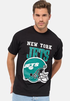 Sort bomulds T-shirt med teksten "NEW YORK JETS" og et teal fodboldhjelm grafik med hvide accenter. Klassisk rund hals, kortærmer.