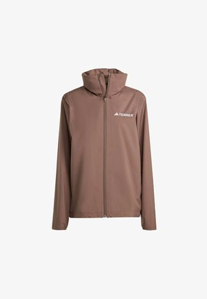 Veste à capuche marron avec fermeture éclair à l'avant et manches longues. Fabriquée en matériau léger, avec un logo "Terrex" blanc sur la poitrine.