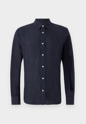 Tumesinine pikavaheline särk, mis on valmistatud leno kangast, nööbiga kraega, esipoolne nööpide seeria ümarate hõbedaste nööpidega ning kergelt tekstureeritud kangas.