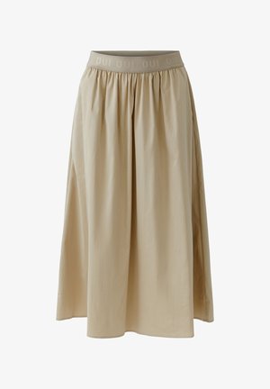 Jupe beige longueur genou avec taille froncée et ceinture élastique présentant un motif répétitif du texte "OUI".