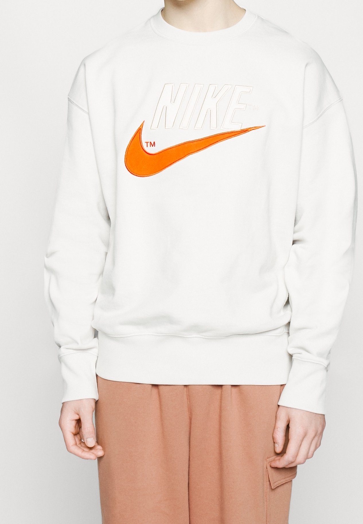 orange and white nike sweatshirt